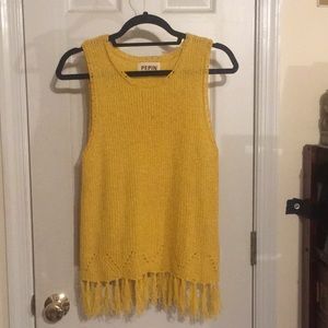 Bright yellow knit top with tassels